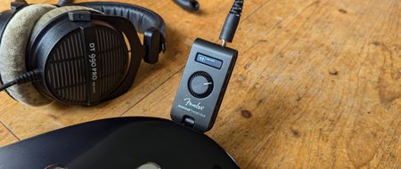 A Fender Mustang Micro Plus plugged into a Telecaster guitar with a pair of studio headphones