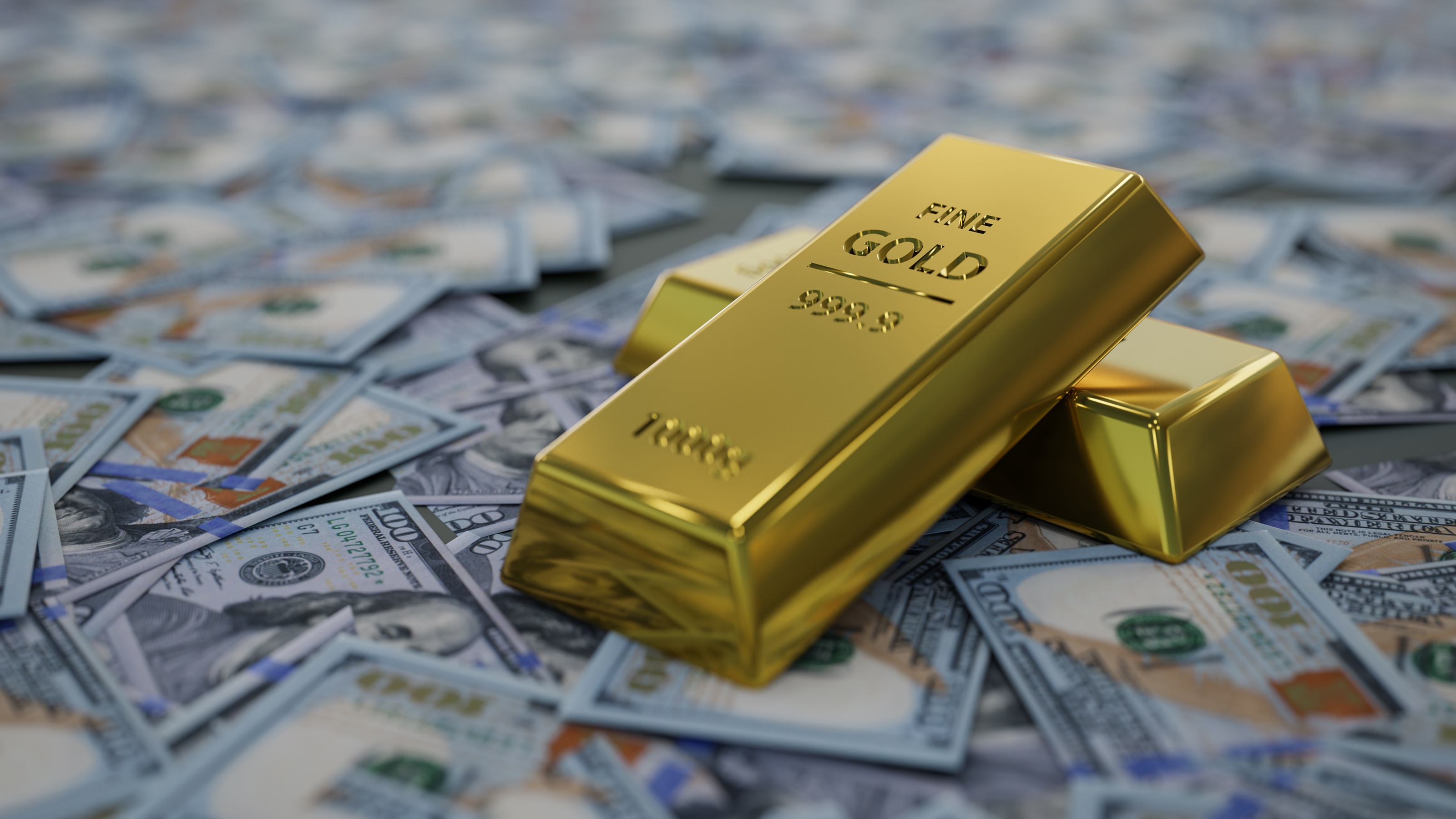 Gold bars sit on top of scattered cash.