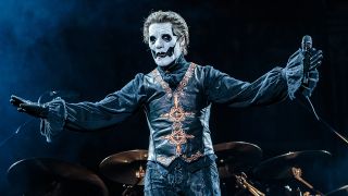 Ghost's Tobias Forge with his arms spread apart on stage