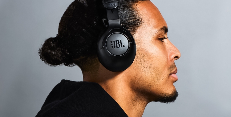 Virgil Van Dijk wearing a pair of black JBL over-ear headphones