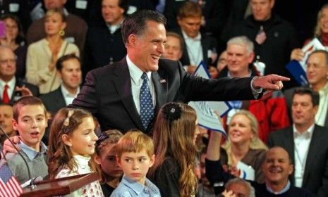 Former Massachusetts Gov. Mitt Romney celebrates in Manchester, N.H., after his big win in the Granite State Tuesday evening.