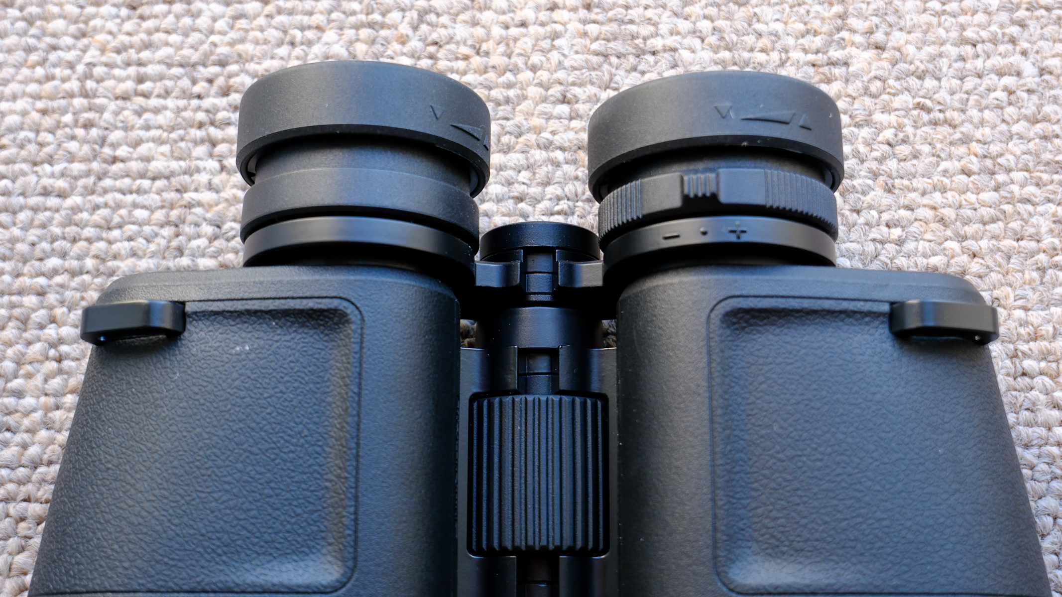 A close-up of the Nikon Action 16x50 binoculars focus dial and diopter adjustment.