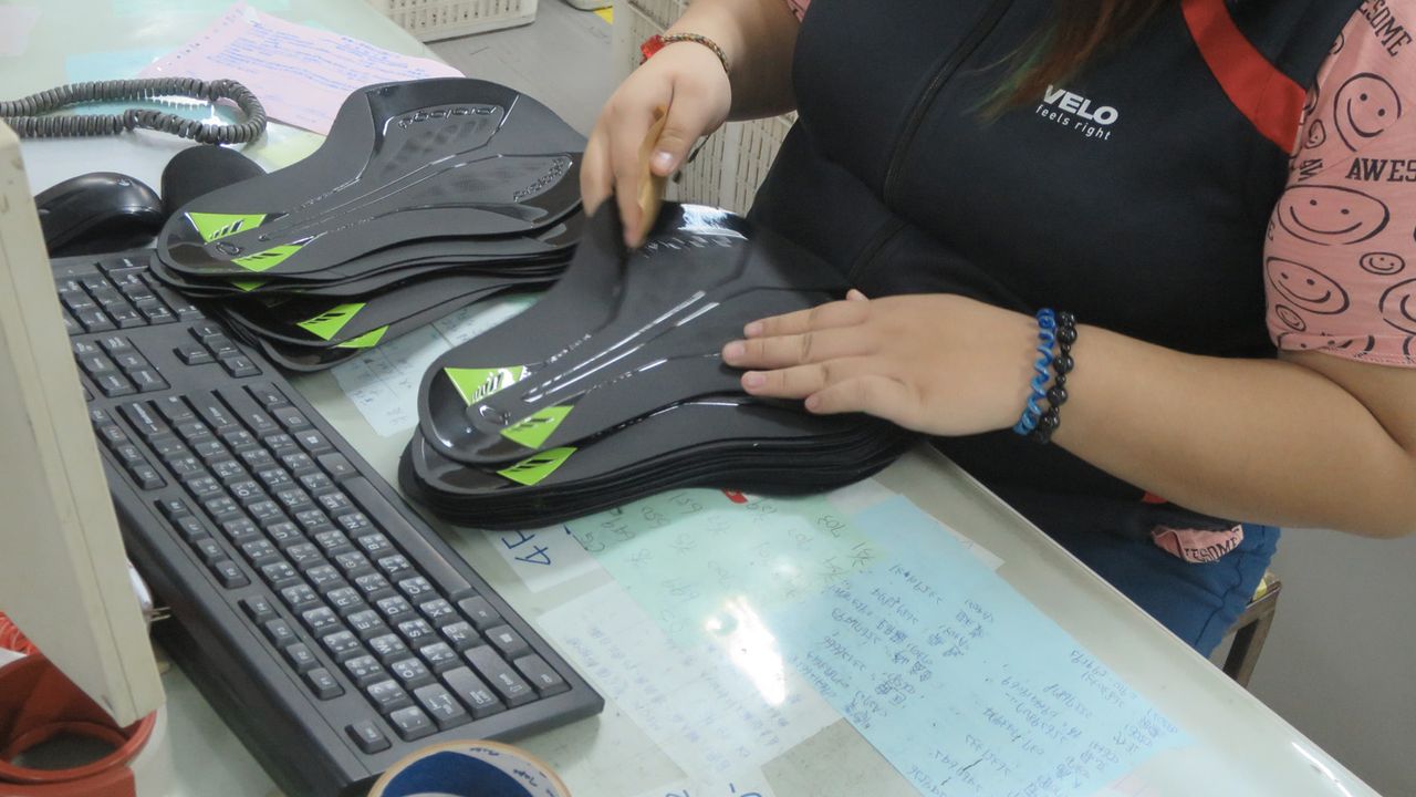 Printed saddle covers are checked before for quality and colour matching before going into the production line