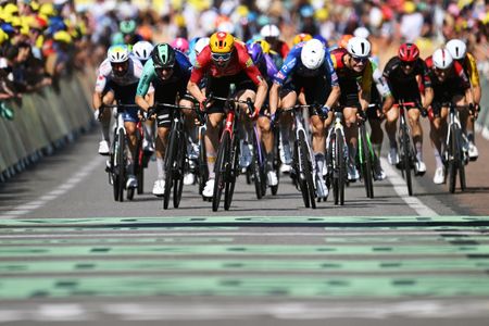 NEVERS, FRANCE - JULY 15: (L-R) Olav Kooij of Netherlands and Decathlon CMA CGM Team, stage winner Soren Waerenskjold of Norway and Team Uno-X Mobility, Jasper Philipsen of Belgium and Team Alpecin-Premier Tech and Milan Fretin of Belgium and Team Cofidis sprint at finish line during the 113th Tour de France 2026, Stage 11 a 161.3km stage from Vichy to Nevers / #UCIWT / on July 15, 2026 in Nevers, France. (Photo by Dario Belingheri/Getty Images)
