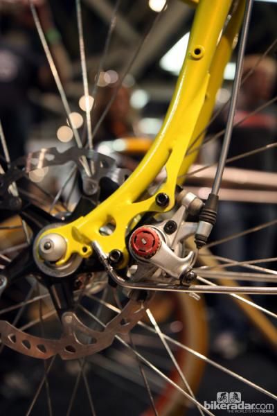 Steel frame builders such as Renald Yip of Yipsan Bicycles have figured out that using longer disc tabs spreads the load out over a greater area, thus still allowing for slimmer fork blades.