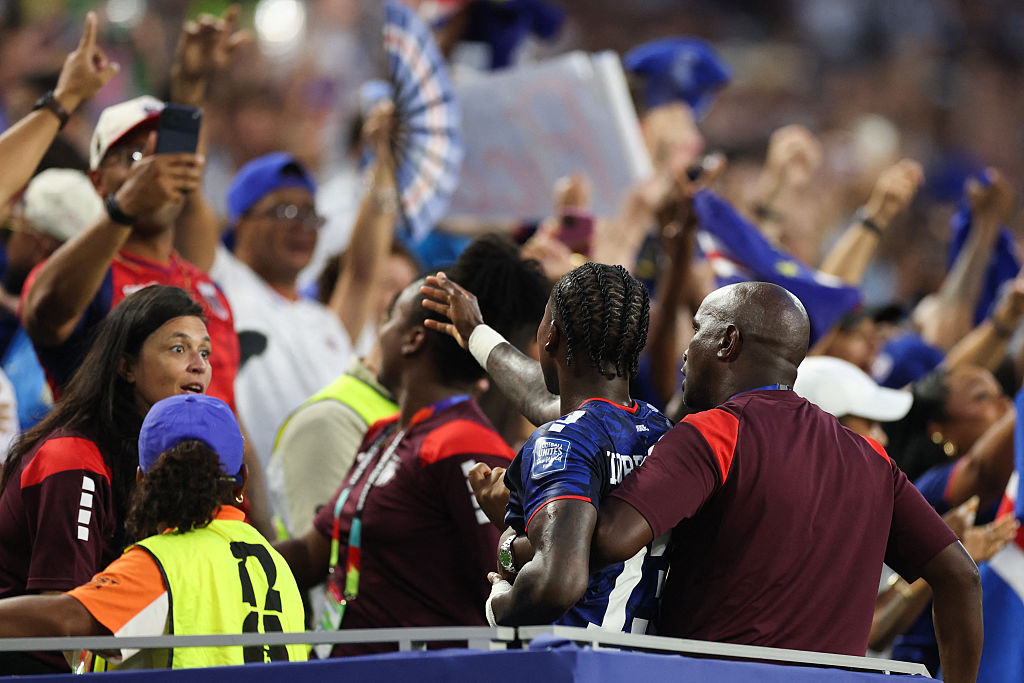 Sidny Cabral jumps into the Cape Verde fans after his extra-time equaliser against Argentina