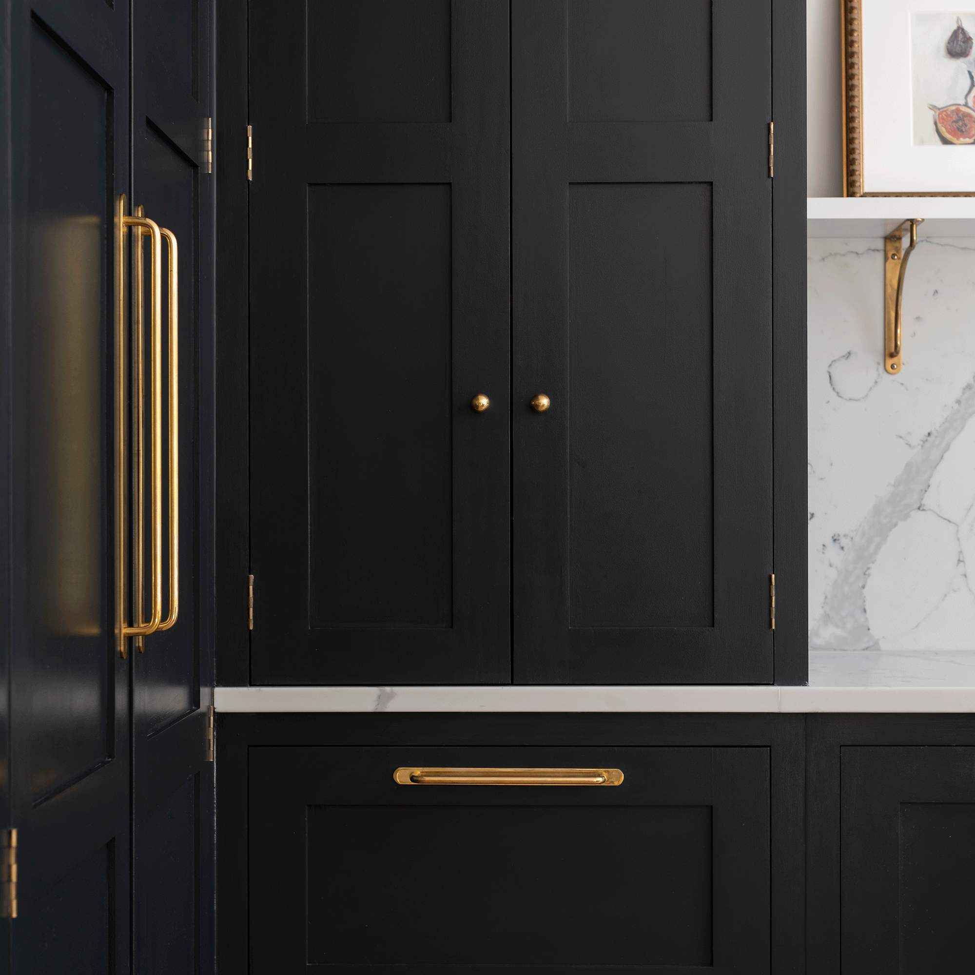 Black kitchen cabinets with gold handles