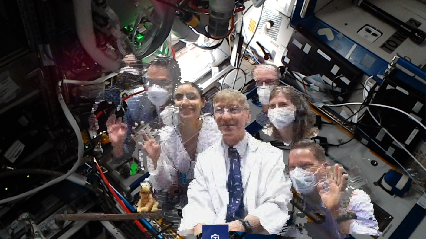 Medical professionals with holograms on the ISS on October 8, 2021. From left, Andrew Madrid, Dr. Fernando De La Pena Llaca, Rlhab Sadik, Dr. Joe Schmid, Kevin Bryant, Mackenzie Hoffman and Wes Tarkington.