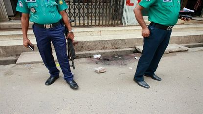 The scene outside the temple in Bangladesh where a Hindu priest was murdered on Friday.