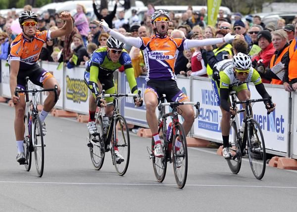 Romain Fondard of Share the Road has won the final stage of the Tour of Southland. Teammate Jack Bauer celebrates also