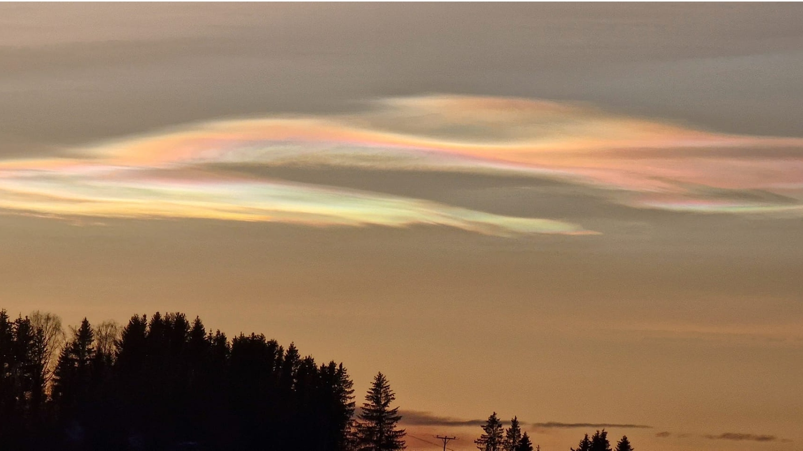 Iridescent, rainbow-colored clouds in the sky