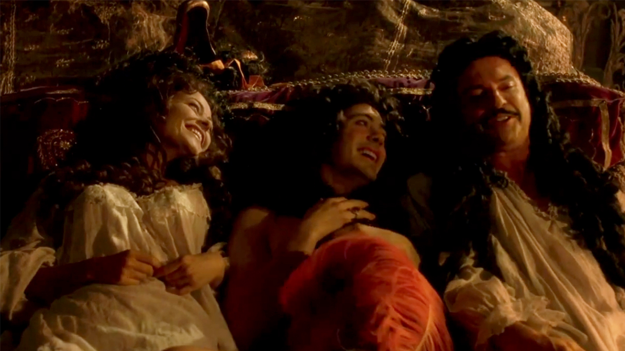 Robert Downey Jr laying between two people in Restoration