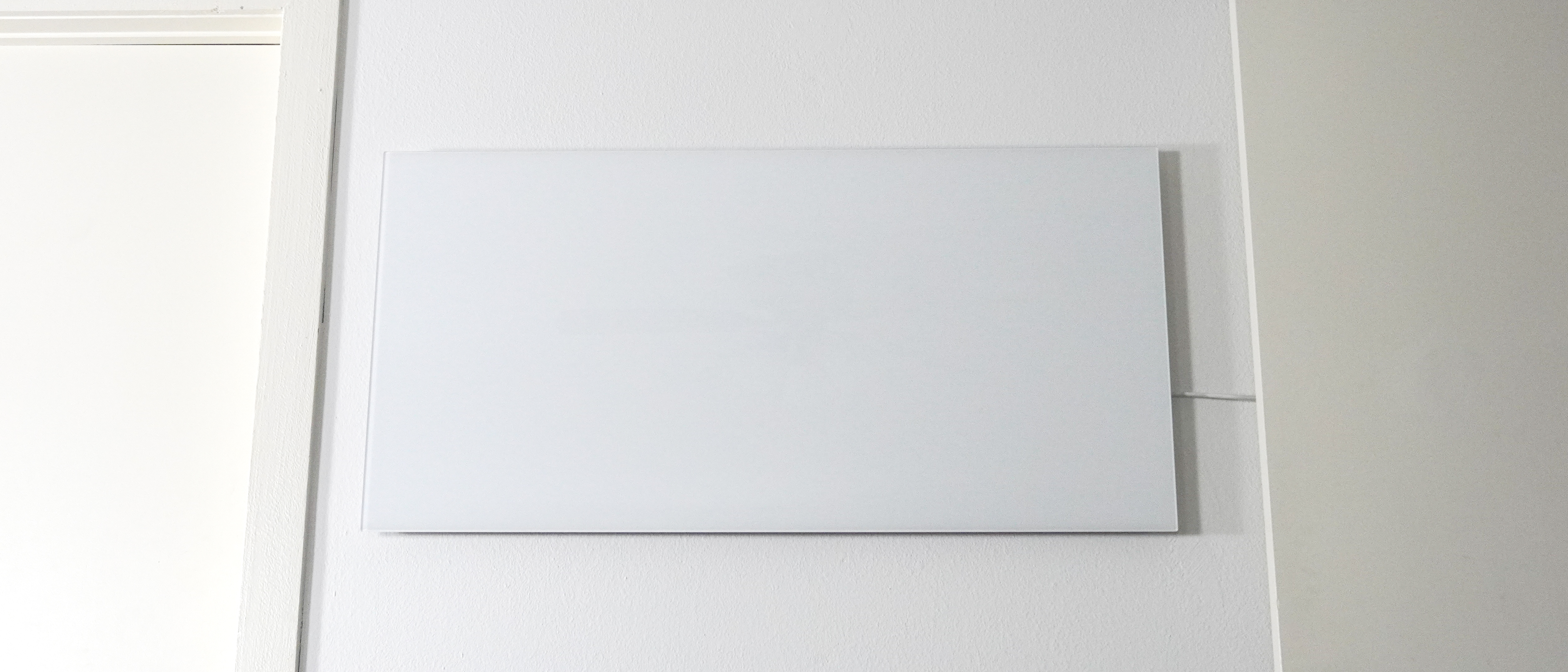 The Boldr Kelvin smart infrared heater installed on a wall