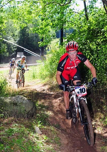 Kathy Sherwin (Kenda-Tomac-Titus) heads into singletrack.