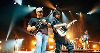 Treaty Oak Revival's Sam Canty is in the background as Lance Vanley and Jeremiah Vanley jam in the foreground.