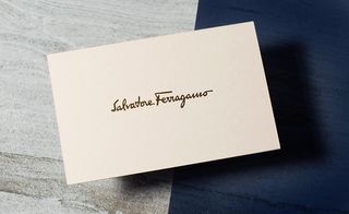 simple, sand-coloured card with a slightly debossed gold signature