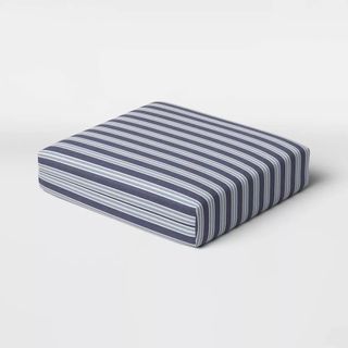 A blue and white striped cushion