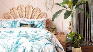 Boho bedroom with rattan leaf headboard with indoor plants to how how to improve air quality in your home