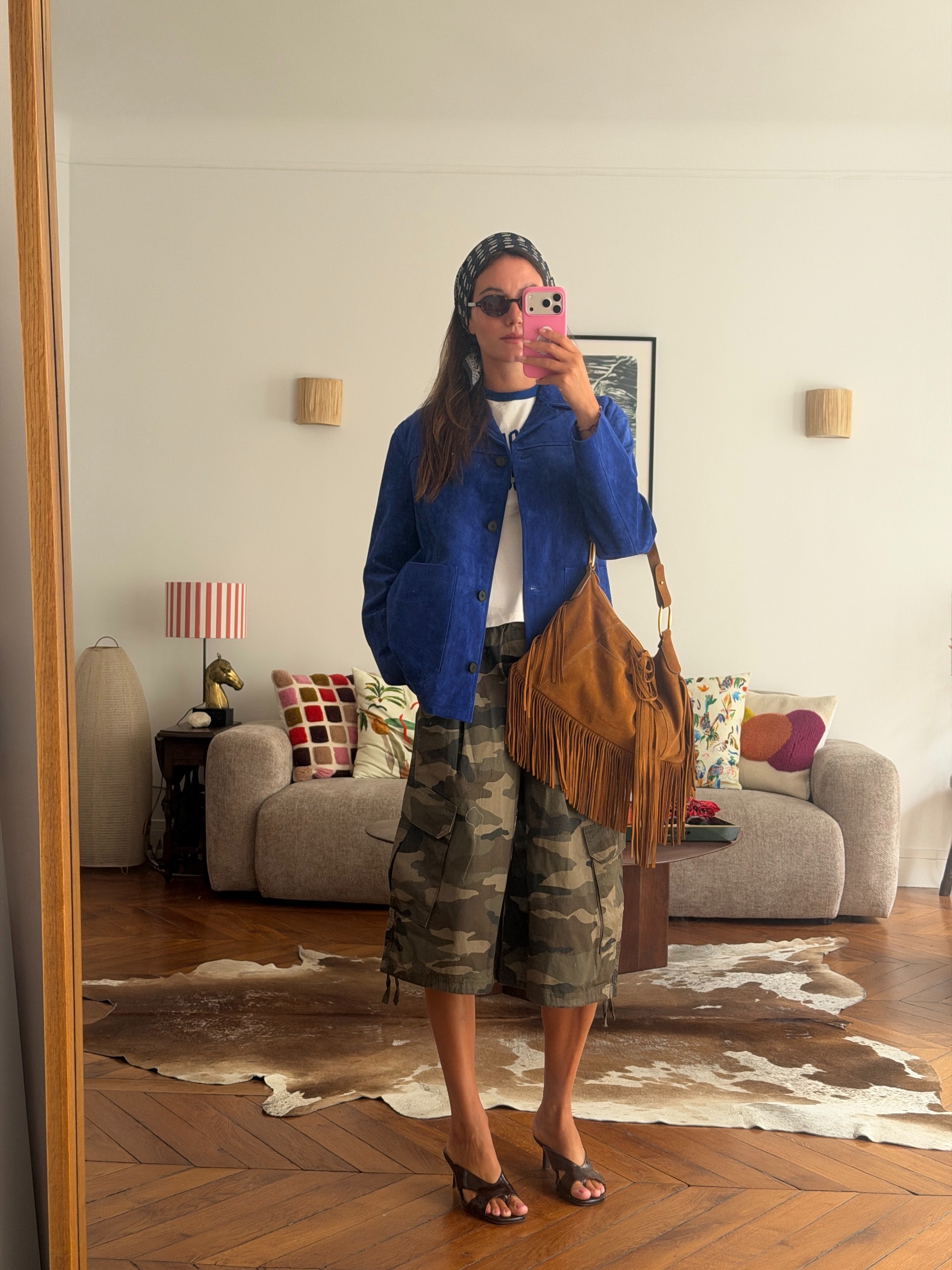 An image of a woman wearing best shoes to wear with camo pants fall 2026