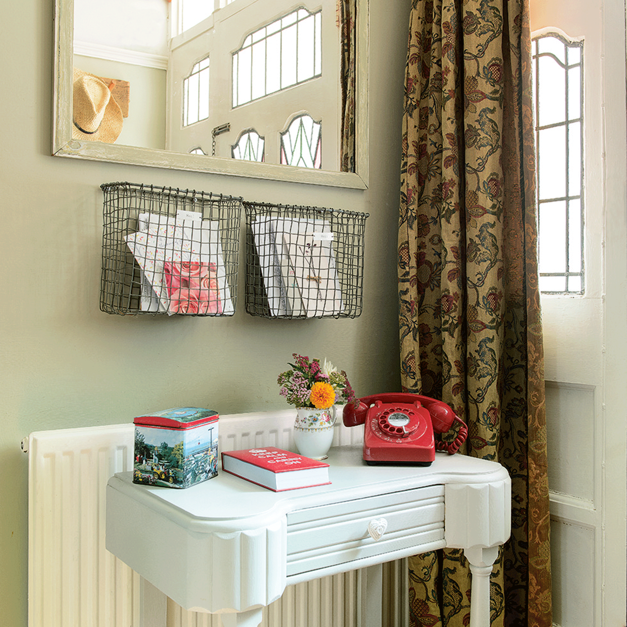 Green hallway with wire letter rack