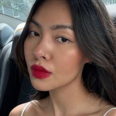 An image featuring @mimixn wearing a red lipstick