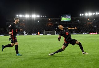 Raphinha celebrates scoring his team's first goal during the Spanish league football match between RC Celta de Vigo and FC Barcelona at the Balaidos stadium in Vigo on November 23, 2024.