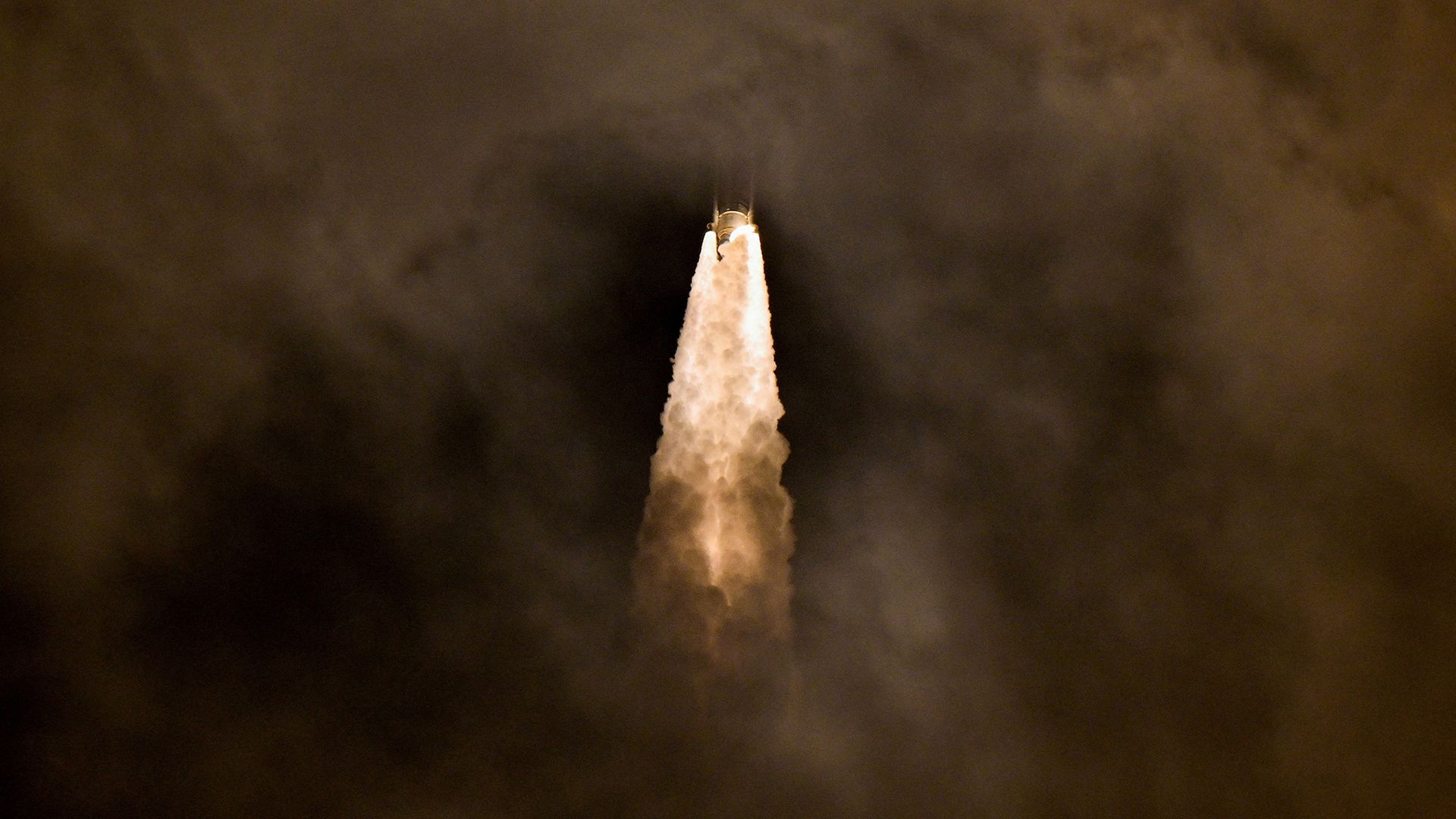 
                                A United Launch Alliance rocket blasts through a cloud layer in Cape Canaveral, Florida, USA
                            