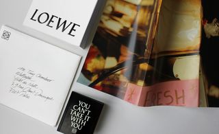 Loewe's creative director featuring a hand-written envelope, a Loewe pad, a fold out poster and a You Can't Take it With You item.