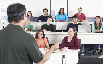 Male lecturer teaching a class of students