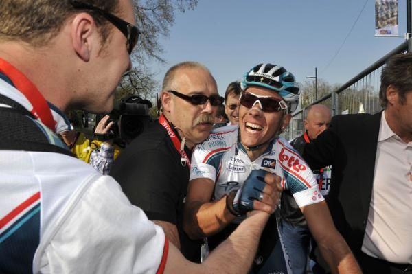 Gilbert celebrates the win with his team.