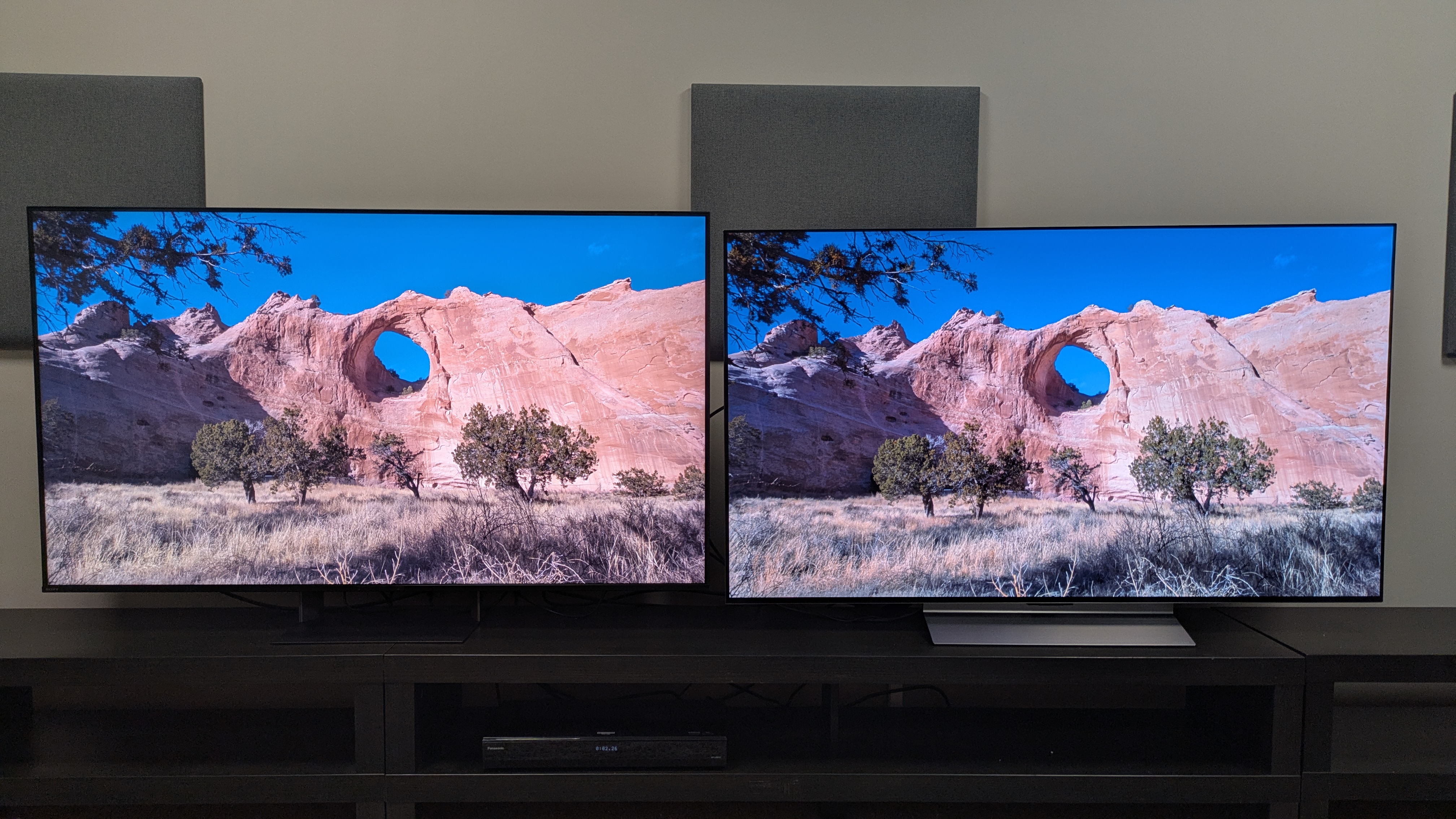 Sony Bravia 7 II (left) vs LG C6 (right) showing shot of a canyon/cliff on screen. The image is much brighter on the Bravia 7 II