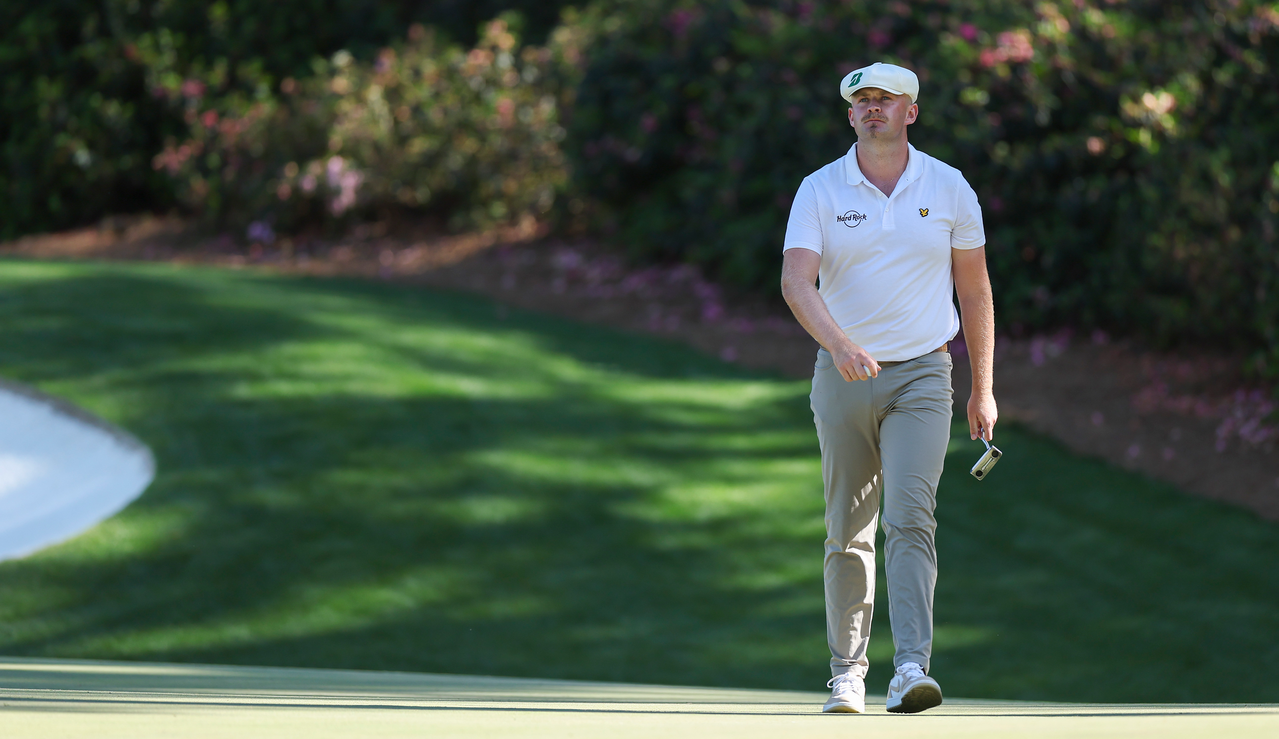 Harry Hall walks on the green at Augusta National