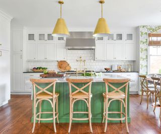 Modern farmhouse kitchen with bold yellow pendant lights above the island