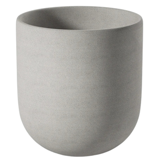 A gray ceramic outdoor planter with drainage holes