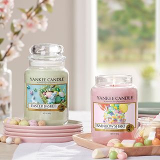 yankee candles in green and pink colour