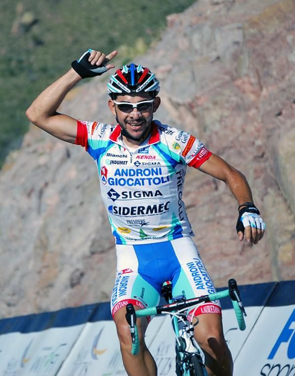 Colombia's Jose Serpa celebrates his victory on stage two's mountaintop finish.