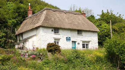 Country cottage for sale © Geography Photos/Universal Images Group via Getty ImagesCountry cottage for sale © 