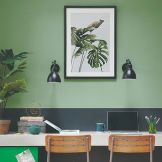 Home office with a houseplant and botanical print