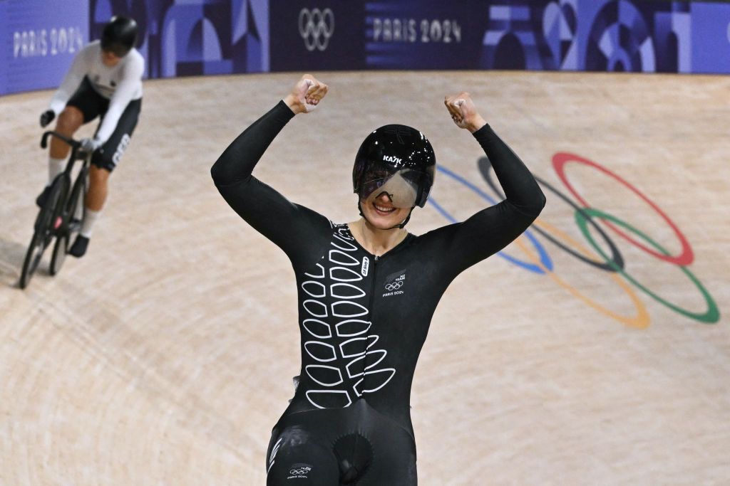 New Zealand's Ellesse Andrews celebrates after winning the women's track cycling sprint final race 2 for gold of the Paris 2024 Olympic Games at the Saint-Quentin-en-Yvelines National Velodrome in Montigny-le-Bretonneux, south-west of Paris, on August 11, 2024. (Photo by SEBASTIEN BOZON / AFP)