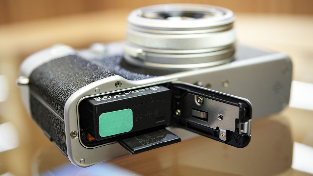 Battery door open on underside of the Fujifilm X100VI