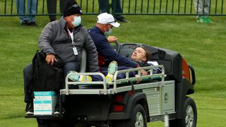 Tom Felton being carted away by medics after collapsing at a tournament