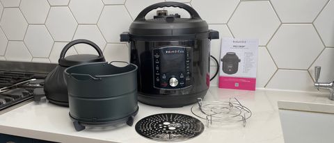The Instant Pot Pro Crisp on a kitchen countrtop with all its accessories