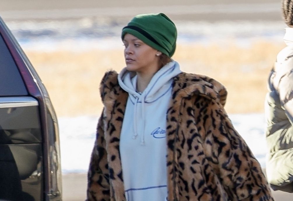 rihanna wearing a leopard coat and gray sweats 2024