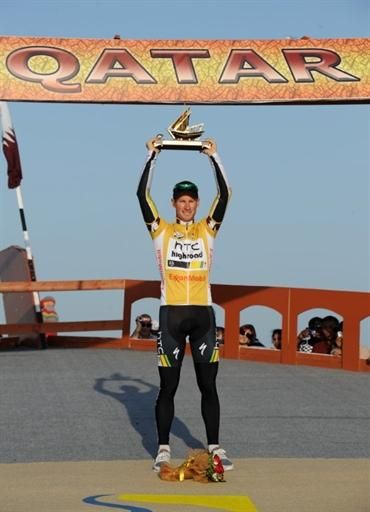 Mark Renshaw (HTC-Highroad) raises the winner's trophy