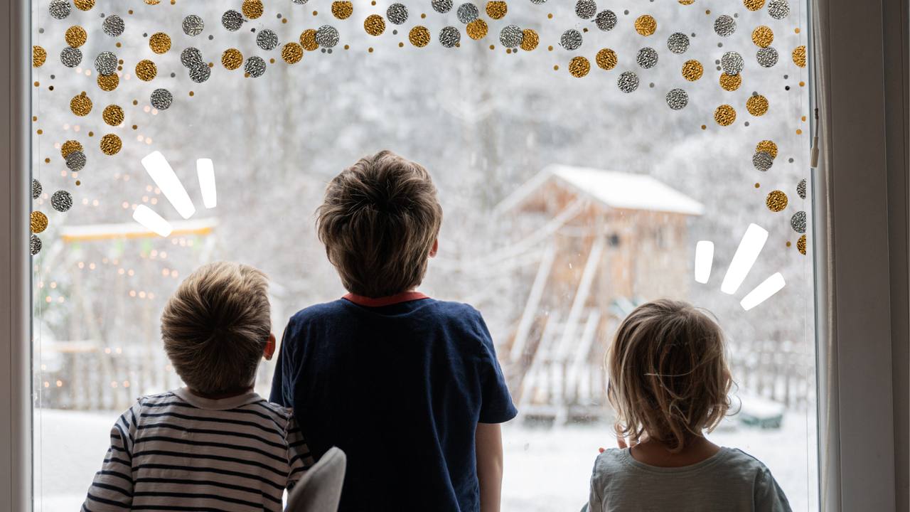 children looking out the window at a cold day