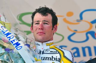 Mark Cavendish of Team Columbia reacts on the podium after winning the 100th Milan-San Remo