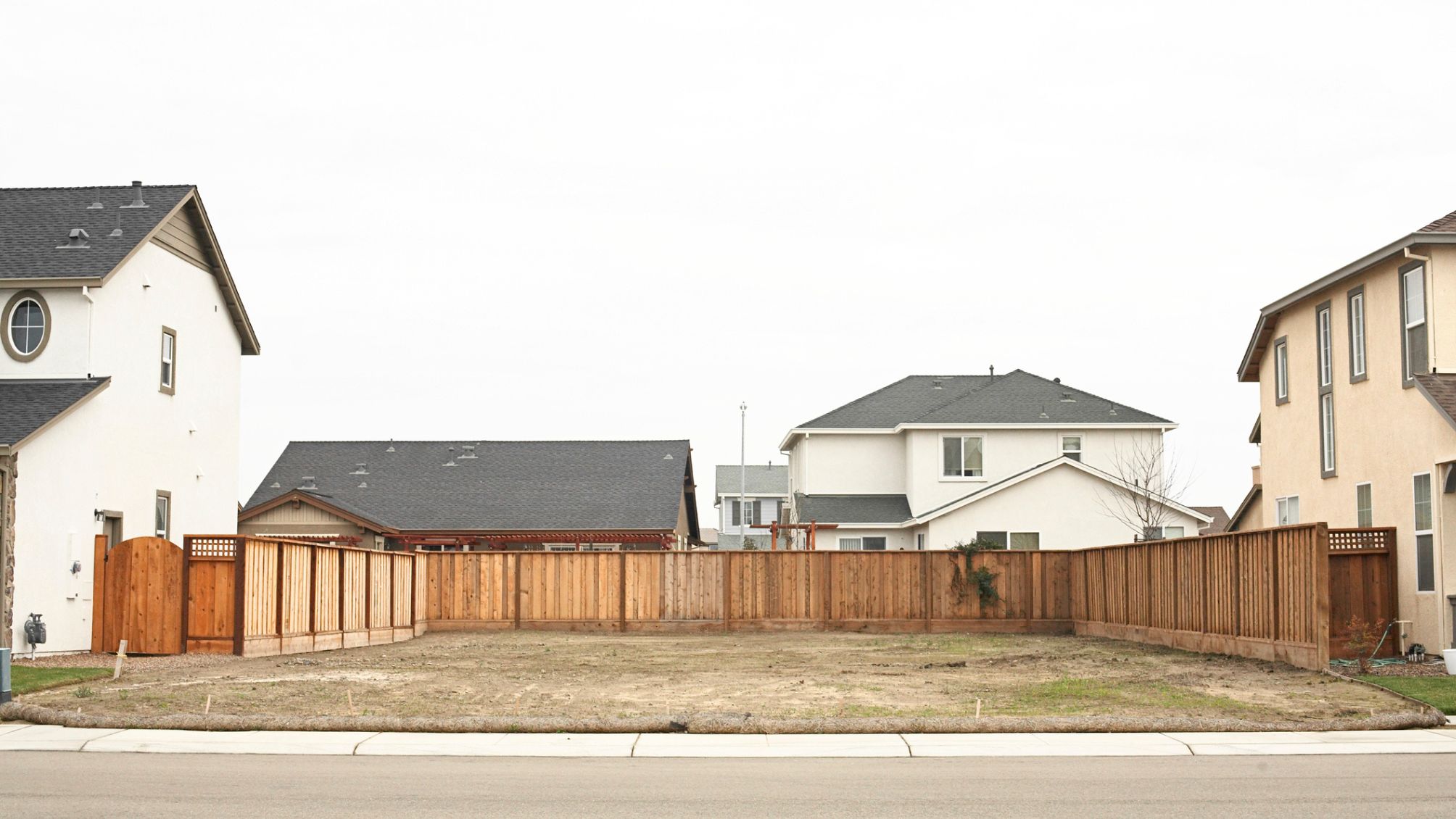A vacant lot between two homes. 