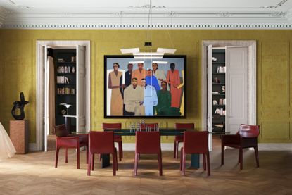 A dining room painted in warm yellow, with a modern table and a large artwork