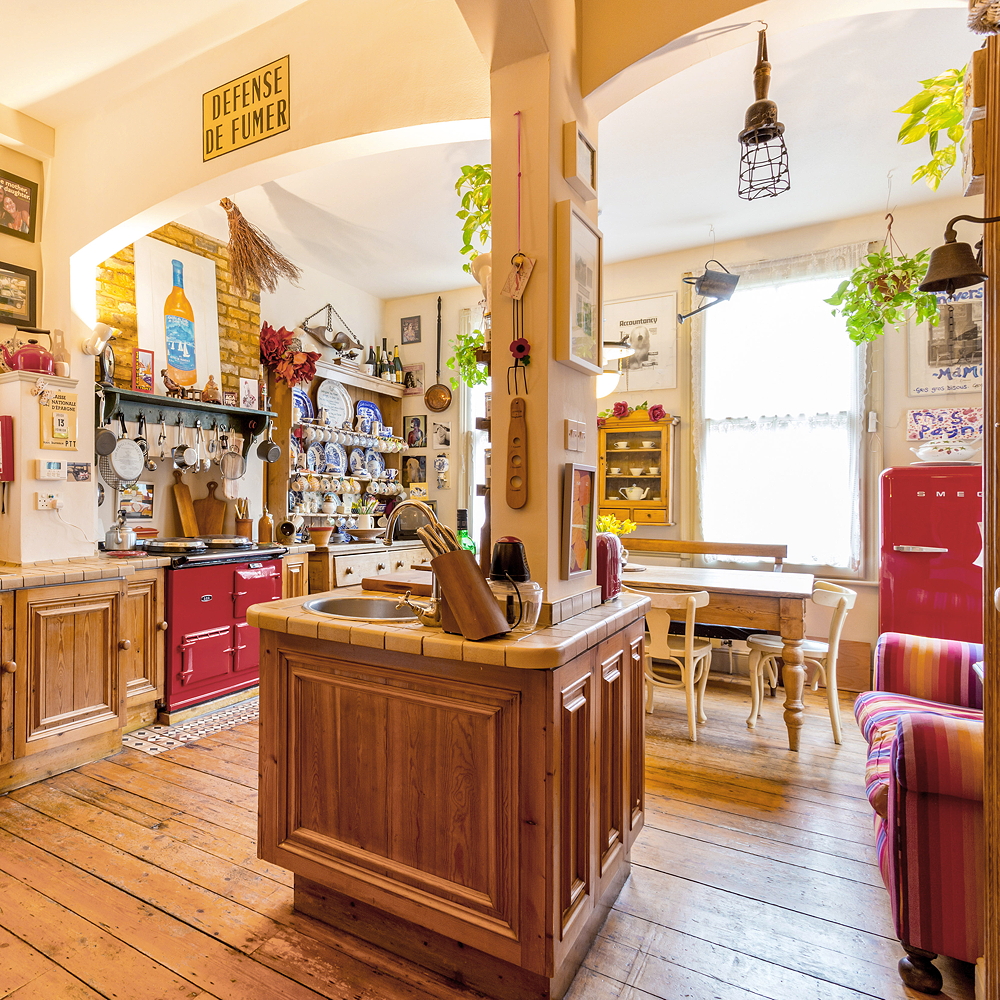 kitchen room with wooden flooring and wooden cabinets