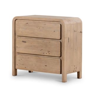 A three drawer wooden dresser